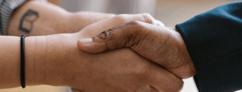 two people shaking hands